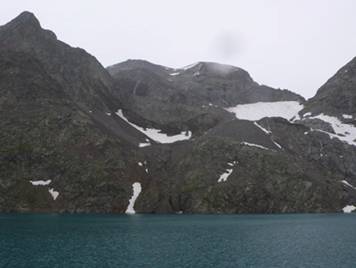 cara nord del Perdiguero amb pluja